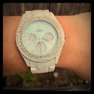 Guess women’s  faux diamond faced white watch